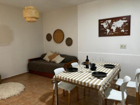 Departamento céntrico con cochera y patio con churrasquera